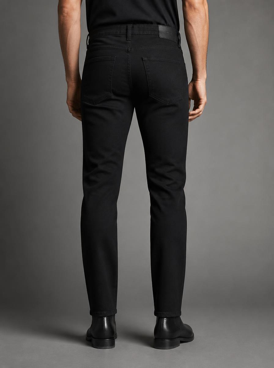 VVXHQ men's VVX Ripped Jean in Onyx Black — Distressed denim, gold VVX waist tag & pocket marks, back view